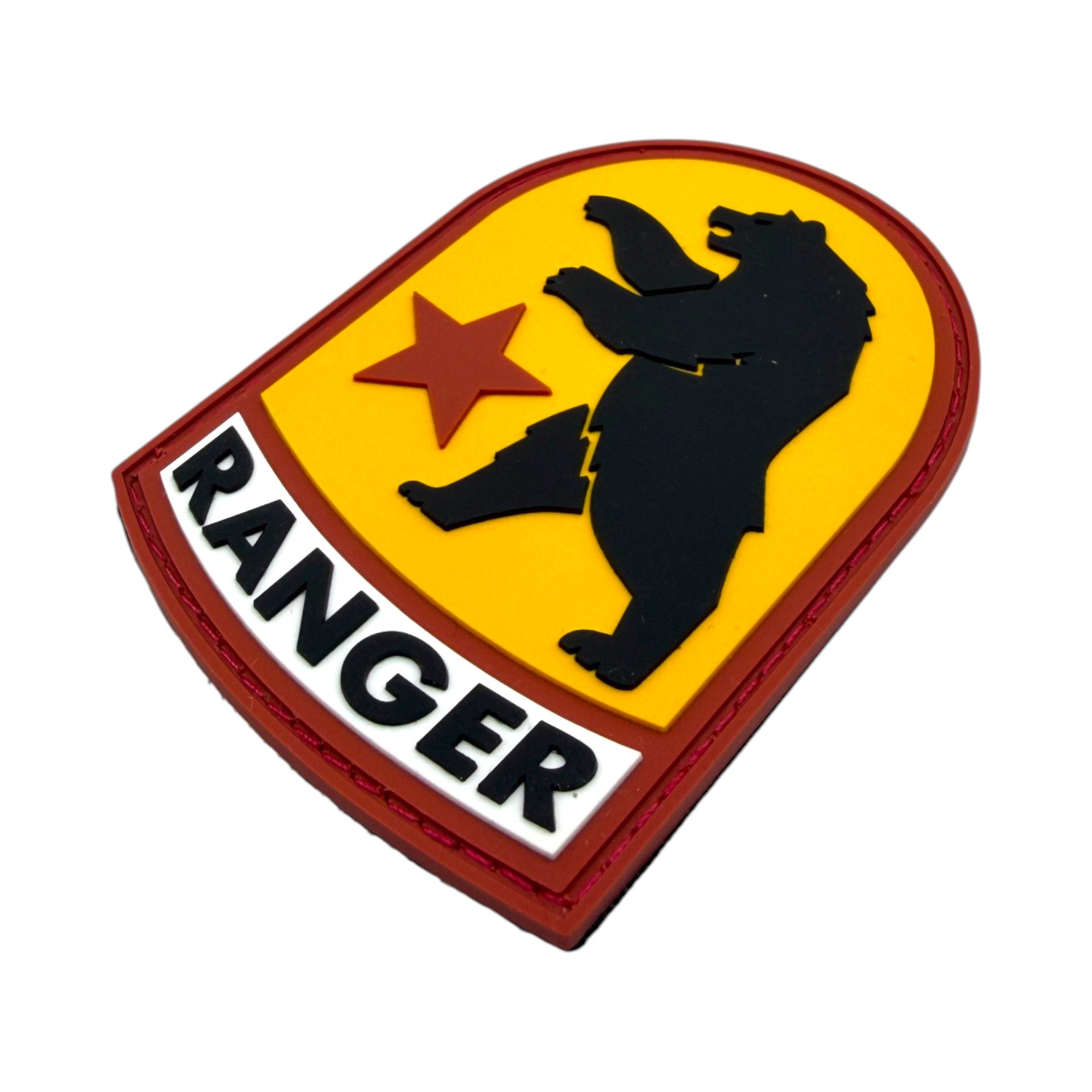 Shield-shaped PVC morale patch featuring the Fallout NCR two-headed bear silhouette and a red star on a yellow background, with a white banner reading "RANGER" at the bottom.