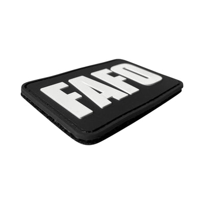 Rectangular black PVC morale patch featuring the acronym "FAFO" in bold white block letters, styled as a parody of a well-known industrial automation logo.