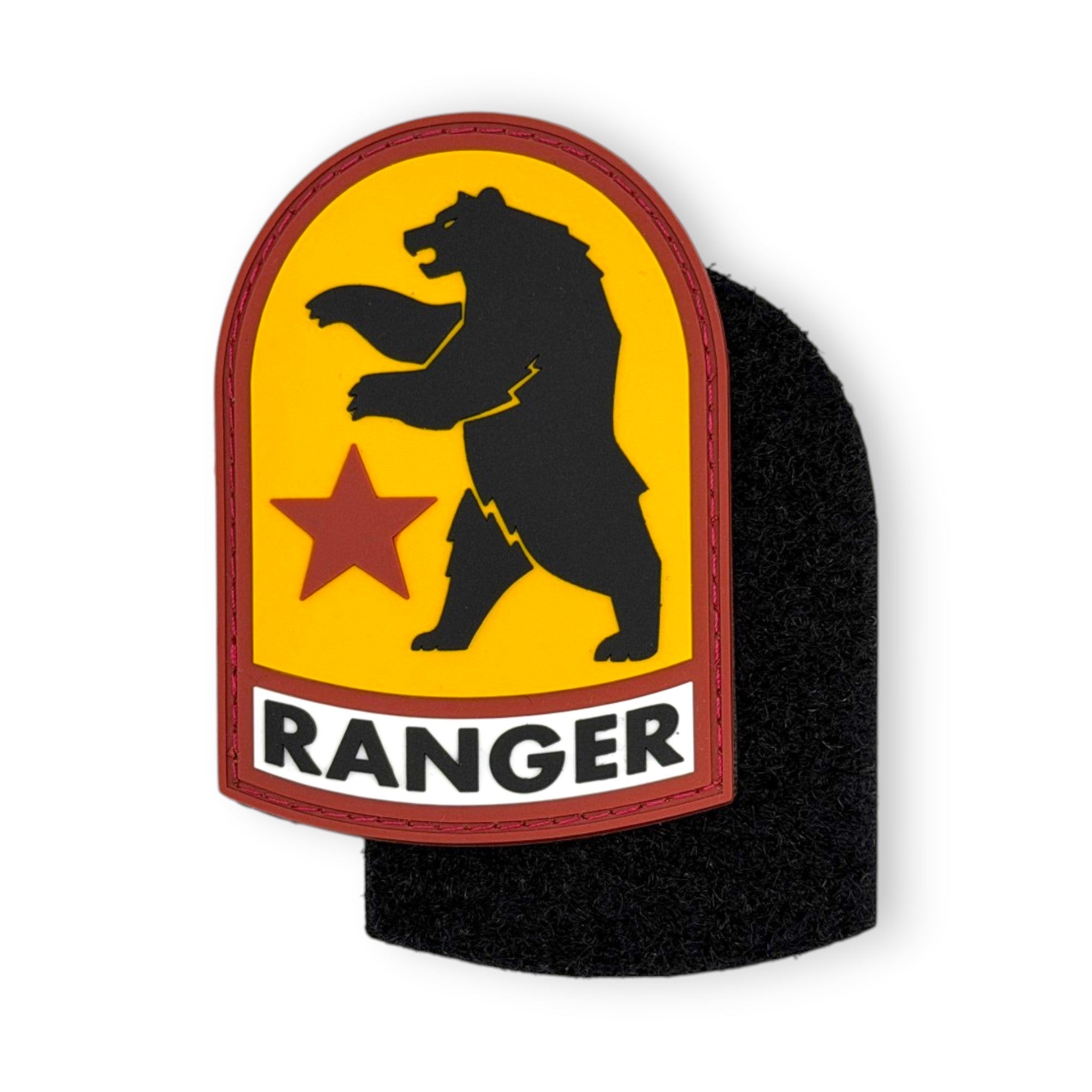 Shield-shaped PVC morale patch featuring the Fallout NCR two-headed bear silhouette and a red star on a yellow background, with a white banner reading "RANGER" at the bottom.