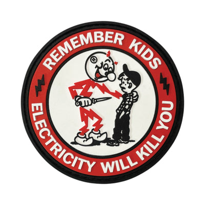 Circular PVC morale patch featuring a dark humor parody of Reddy Kilowatt and a kid, surrounded by a red border with the text "Remember Kids Electricity Will Kill You".