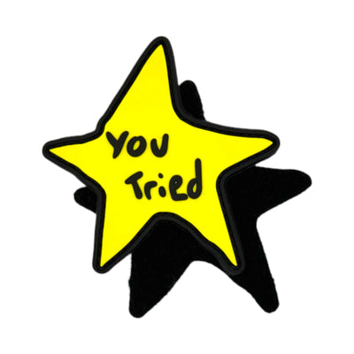 Yellow doodle-style star morale patch with a black border and the words "You Tried" written in the center in a handwritten black font.
